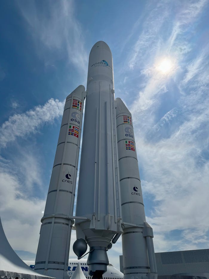 The Ariane rocket display under a bright blue sky at Le Bourget, France.